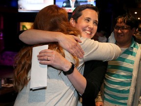 Chandra Pasma, the NDP candidate for the Ottawa West-Nepean riding, is congratulated following her upset victory over PC incumbent Jeremy Roberts Thursday night.