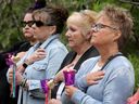 Seven years later and the pain is still evident as a tear rolls down the cheek of Faye Cassista (second from right) at a vigil for Basil Bortuski's victims. On Monday morning, the day an inquest into the deaths of three Ottawa Valley women (Carol Culleton, Anastasia Kuzyk and Nathalie Warmerdam) began, a vigil was held in their honour at the Women's Monument in Petawawa. 