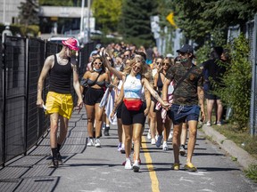 Festival-goers go to the entrance of the Escapade Music Festival held at Parc RCGT last summer.