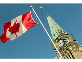 The flag is raised in front of the Peace Tower in this file photo.