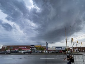 Storm clouds rolled over Merivale Road on Thursday, Jun. 16, 2022. Today's weather is unsettled, but shouldn't be as extreme.