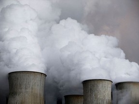 FILE PHOTO: Steam rises from the cooling towers of the coal power plant of RWE, one of Europe's biggest electricity and gas companies in Niederaussem, Germany, March 3, 2016.