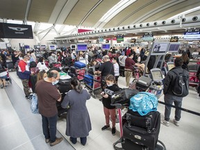 Travellers waiting at Toronto Pearson Airport's Terminal 1: Many have run into cancelled flights, hours of waiting and lack of staff to offload airplanes arriving at the gates.
