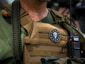 A member of the U.S. right-wing militia group Three Percenters joins various militia groups at Stone Mountain, Georgia, August 15, 2020. Canada last June named the group a terrorist entity, saying it poses a 'significant threat' to domestic security.