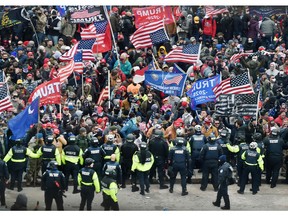 In this file photo taken on Jan. 6, 2021, Trump supporters clash with police and security forces as they storm the U.S. Capitol in Washington, DC.