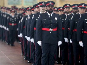 A large group of Ottawa Police officers, many who were hired in 2019 and worked through the pandemic, finally received their badges in a ceremony at the Lansdowne Park Aberdeen Pavilion Tuesday.