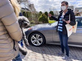 Ottawa West-Nepean NDP candidate Chandra Pasma wears a mask while canvassing on April 22.
