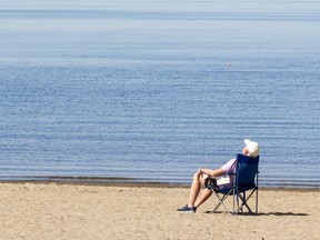 FILE PHOTO: An individual is seen enjoying the warm weather at Westboro Beach in May.
