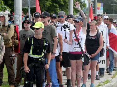 Hundreds of supporters came out to cheer on James Topp (in reflective vest) in a parking lot in Bells Corners on the final day of his cross Canada march to downtown Ottawa Thursday.