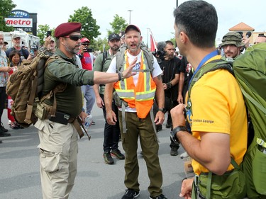 He gives a short speech to supporters, telling them to not be provoked etc. and be respectful as they marched with him.
Hundreds of supporters came out to cheer on James Topp (in reflective vest) in a parking lot in Bells Corners on the final day of his cross Canada march to downtown Ottawa Thursday.