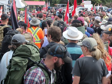 Hundreds of supporters came out to cheer on James Topp (in reflective vest) in a parking lot in Bells Corners on the final day of his cross Canada march to downtown Ottawa Thursday.