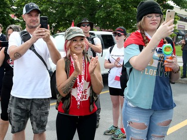 Hundreds of supporters came out to cheer on James Topp (in reflective vest) in a parking lot in Bells Corners on the final day of his cross Canada march to downtown Ottawa Thursday.