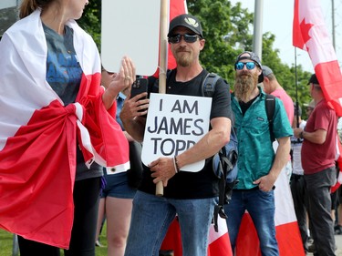 Hundreds of supporters came out to cheer on James Topp (in reflective vest) in a parking lot in Bells Corners on the final day of his cross Canada march to downtown Ottawa Thursday.