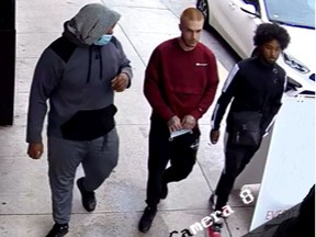 Kingston Police are seeking the identity of the man on the left of this image taken from video. They believe he was in the company of the two men on the right prior to their murders in October, 2021.