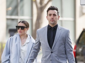 Canadian musician Jacob Hoggard arrives alongside his wife Rebekah Asselstine, for his sex assault trial at the Toronto courthouse on Tuesday, May 10, 2022 in Toronto.