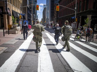 Two RCMP officers along with two tactical paramedics made their way up and down the streets around Parliament Hill on Saturday afternoon.