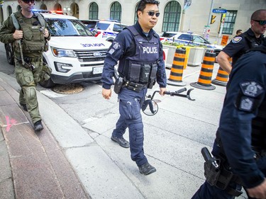 Two RCMP officers along with two tactical paramedics made their way up and down the streets around Parliament Hill on Saturday afternoon.
