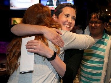 Chandra Pasma, the NDP candidate for the Ottawa West Nepean riding, is congratulated by her family (including husband Matt Helleman, twins Luc and Clara, 9, and daughter Mira, 11) and supporters at the Barley Mow pub on Merivale following her tight victory over the PC incumbent Jeremy Roberts.