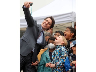 Along with other politicians and dignitaries, Prime Minister Justin Trudeau was on hand for the raising of the Pride flag on Parliament Hill Wednesday.
Ayda Rymes (front) and Aryan Dharamshi (rear right) could barely contain their excitement when the PM stopped for selfies with their class from the Dearcroft Montessori school in Oakville.