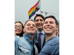Along with other politicians and dignitaries, Prime Minister Justin Trudeau was on hand for the raising of the Pride flag on Parliament Hill Wednesday.
He stopped for selfies with the crowd following the ceremony as the flag waved proudly in the background.