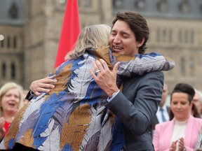 Along with other politicians and dignitaries, Prime Minister Justin Trudeau was on hand for the raising of the Pride flag on Parliament Hill Wednesday.
Here, he gets a hug from former Green Party leader Elizabeth May, who also delivered remarks.