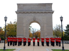 A file photo shows Royal Military College officer cadets at the Memorial Arch in Kingston.