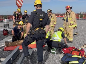 Firefighters rescue construction worker on sixth floor of building on Cummings Avenue Tuesday.