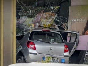 A car has crashed into a store after crashing into a crowd of people in central Berlin, Germany, Wednesday, June 8, 2022.
