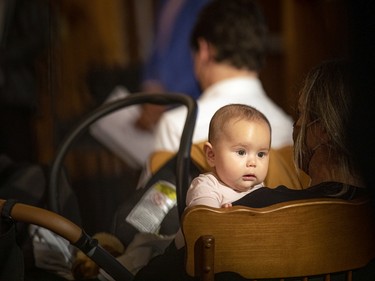 A young child waits quietly during the kickoff event indoors for the Summer Solstice Indigenous Festival on Tuesday.