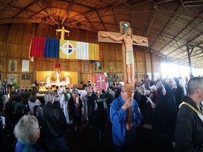 A procession makes its way out at the end of a mass at the Lac Ste. Anne Pilgrimage in this undated handout image provided on June 17, 2022, by the Catholic Diocese of Archdiocese of Edmonton.