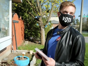 Nepean Liberal candidate Tyler Watt wears a masks while canvassing on May 5.