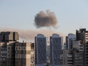 Smoke rises after a missile strike in Kyiv, Ukraine, June 26, 2022.