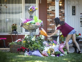 A memorial of flowers was at a home where Anne-Marie Ready, 50, and her daughter Jasmine Ready, 15, died in a stabbing attack on June 27.