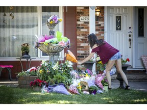 A flower memorial was set up in the front yard of the home on Anoka Street where Anne-Marie Ready, 50, and her daughter Jasmine Ready, 15, were killed in a June 27 stabbing.