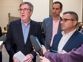 (From left) Jim Watson, the city's then-mayor, John Manconi, who served as general manager for transportation services  for the city, and then-city general manager Steve Kanellakos field questions in early 2020.