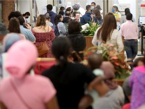 A long line of people seeking Canadian passports appears daily at the Service Canada office in Nepean.