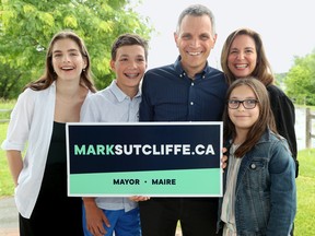 With his wife, Ginny, and three kids (Erica, 23, Jack, 10 and Kate, 13), Mark Sutcliffe announces his candidacy for mayor at a park in Kanata.