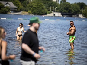 People keep cool in the water during HOPE Volleyball SummerFest on Saturday, July 16, 2022.