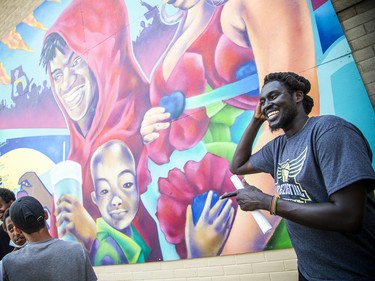 An unveiling of a mural made by and for the youth of Lowertown in solidarity with the Black Lives Matter movement took place Saturday, July 16, 2022, at the back side of the Rideau Street Loblaws. Manock Lual, CEO of Prezdential Basketball, joked with some youngsters at the even Saturday.