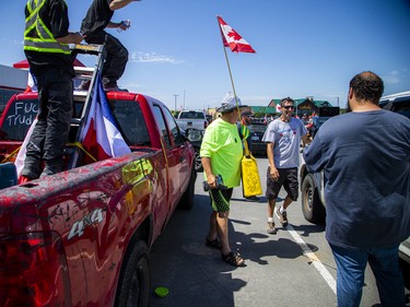 A group of 'freedom' supporters gathered together in the west end of Ottawa  in the Structube parking lot on Saturday, July 23, 2022. The group left the lot midday and did a slow-roll protest in support of the Dutch farmers along the 417. The group then met with another group of protesters outside the Dutch Embassy in Constitution Square and moved their protest around the downtown core hitting the National War Memorial, Parliament Hill and many downtown streets.