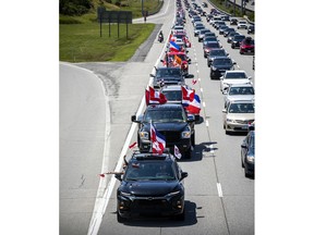 A group of 'freedom' supporters gathered together in the west end of Ottawa  in the Structube parking lot on Saturday, July 23, 2022. The group left the lot midday and did a slow-roll protest in support of the Dutch farmers along the 417. The group then met with another group of protesters outside the Dutch Embassy in Constitution Square and moved their protest around the downtown core hitting the National War Memorial, Parliament Hill and many downtown streets.