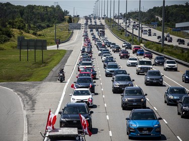 A group of 'freedom' supporters gathered together in the west end of Ottawa  in the Structube parking lot on Saturday, July 23, 2022. The group left the lot midday and did a slow-roll protest in support of the Dutch farmers along the 417. The group then met with another group of protesters outside the Dutch Embassy in Constitution Square and moved their protest around the downtown core hitting the National War Memorial, Parliament Hill and many downtown streets.