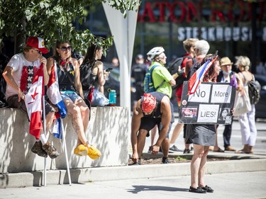 A group of 'freedom' supporters gathered together in the west end of Ottawa  in the Structube parking lot on Saturday, July 23, 2022. The group left the lot midday and did a slow-roll protest in support of the Dutch farmers along the 417. The group then met with another group of protesters outside the Dutch Embassy in Constitution Square and moved their protest around the downtown core hitting the National War Memorial, Parliament Hill and many downtown streets. Joyce Rombouts came to the protest in traditional wooden clogs.