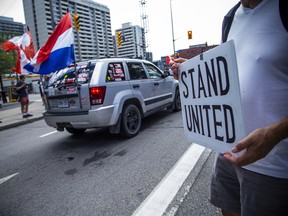 A group of 'freedom' supporters gathered together in the west end of Ottawa  in the Structube parking lot on Saturday, July 23, 2022. The group left the lot midday and did a slow-roll protest in support of the Dutch farmers along the 417. The group then met with another group of protesters outside the Dutch Embassy in Constitution Square and moved their protest around the downtown core hitting the National War Memorial, Parliament Hill and many downtown streets.