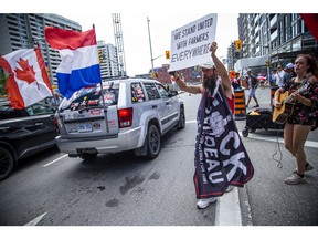 A group of 'freedom' supporters gathered together in the west end of Ottawa  in the Structube parking lot on Saturday, July 23, 2022. The group left the lot midday and did a slow-roll protest in support of the Dutch farmers along the 417. The group then met with another group of protesters outside the Dutch Embassy in Constitution Square and moved their protest around the downtown core hitting the National War Memorial, Parliament Hill and many downtown streets.