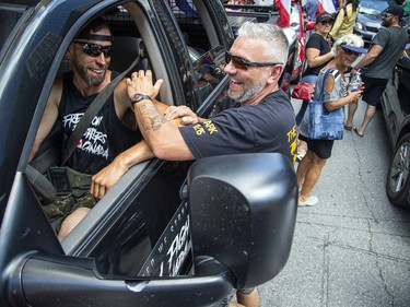 A group of 'freedom' supporters gathered together in the west end of Ottawa  in the Structube parking lot on Saturday, July 23, 2022. The group left the lot midday and did a slow-roll protest in support of the Dutch farmers along the 417. The group then met with another group of protesters outside the Dutch Embassy in Constitution Square and moved their protest around the downtown core hitting the National War Memorial, Parliament Hill and many downtown streets.