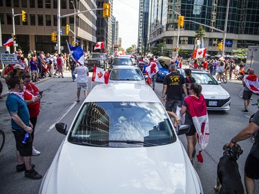 A group of 'freedom' supporters gathered together in the west end of Ottawa  in the Structube parking lot on Saturday, July 23, 2022. The group left the lot midday and did a slow-roll protest in support of the Dutch farmers along the 417. The group then met with another group of protesters outside the Dutch Embassy in Constitution Square and moved their protest around the downtown core hitting the National War Memorial, Parliament Hill and many downtown streets.