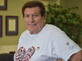 Anthony Cuzzocrea, president of Planmar Financial Corp., smiles in his Love First t-shirt while standing in his London, Ont. office.