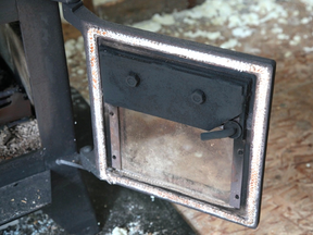This newly-replaced wood stove door gasket is ready to use. Without a complete seal by this gasket, airtight wood stoves cannot be controlled properly.
