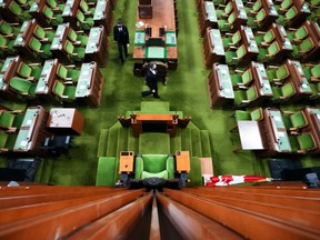 Pages makes preparations in The House of Commons on Parliament Hill in Ottawa on Friday, Nov. 19, 2021.